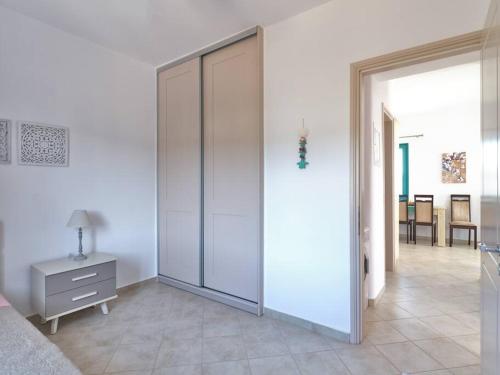 a bedroom with a large sliding glass door at Two Bedroom Cycladic House With Sea View in Kampos Paros