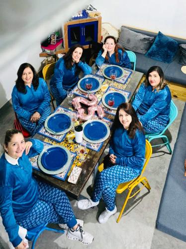 a group of women sitting around a table at Casa De Campo Mirador H&L in San Antonio de las Alzanas