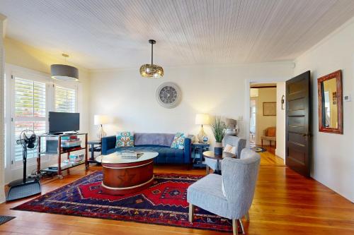 a living room with a couch and a table at Stars and Stripes Forever in Southwest Harbor