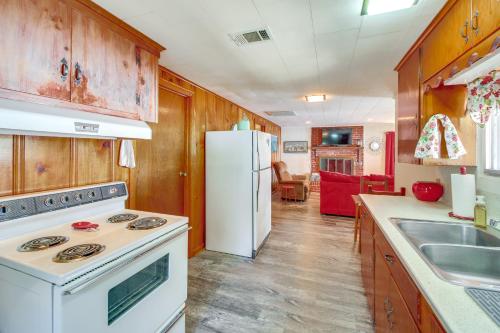 a kitchen with a white stove and a refrigerator at 10 Mi to National Park Patio at Hot Springs Home in Hot Springs