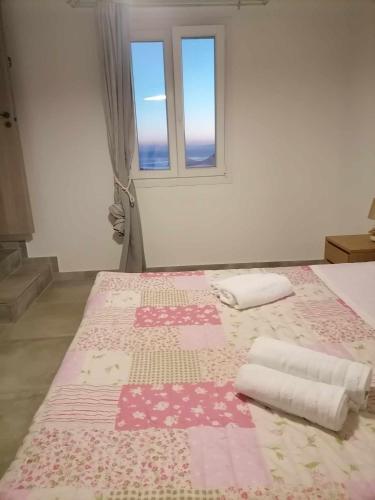 Ein Bett oder Betten in einem Zimmer der Unterkunft Rita's Blue View