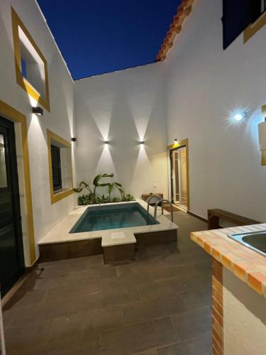 a bathroom with a swimming pool in a house at Casa Valada My Land in Valada