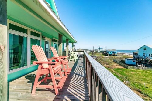two chairs sitting on the balcony of a house at Spectacular Sunrise Sunset & Surf Views in Surfside Beach