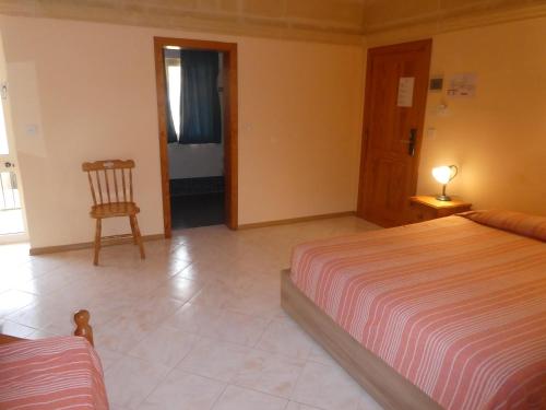 Кровать или кровати в номере San Antonio Guesthouse