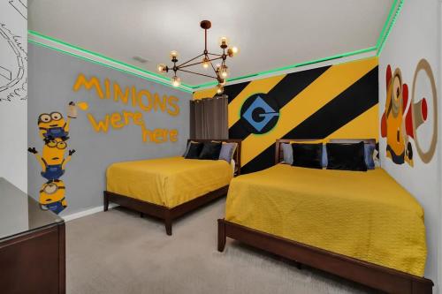 a bedroom with two beds and a mural of homer simpson at EPIC 12 Bedroom Home with Private Pool in Kissimmee