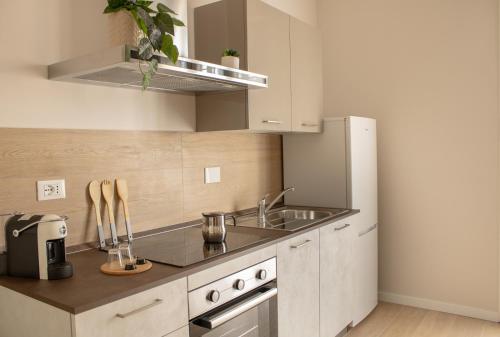 a kitchen with a sink and a stove at Mias flat in Scandicci