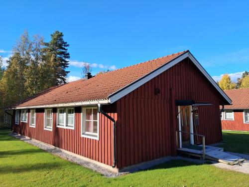 a red building with a red roof at Furudals Bruk in Furudals Bruk