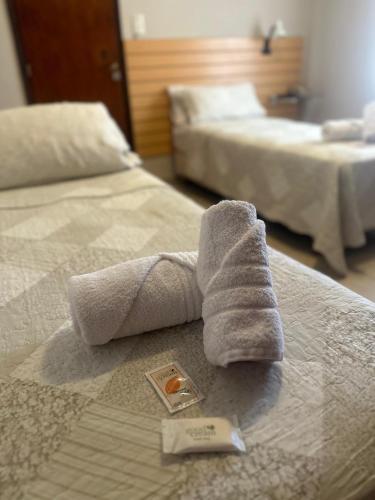 Ένα ή περισσότερα κρεβάτια σε δωμάτιο στο Hotel Punta Lavalle