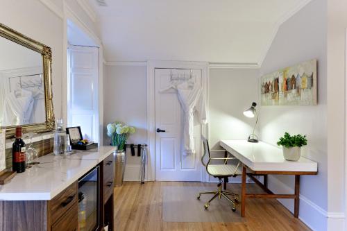 a office with a desk and a chair in a room at Nevis Estate Boutique Hotel in Perth