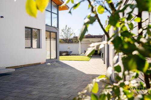 a courtyard of a house with a patio at City Oasis Villa in Sibiu in Sibiu