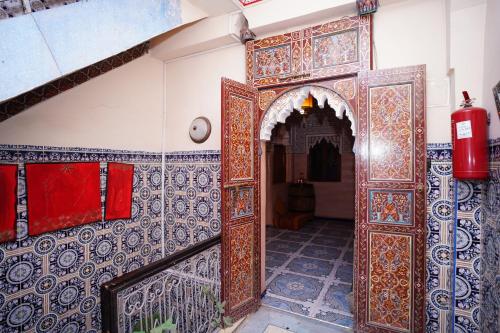 an entrance to a building with an ornate door at Riad Dar Essassi 23 in Marrakech