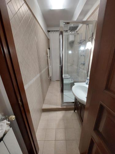 a bathroom with a shower and a sink and a toilet at Tina's House in Barletta