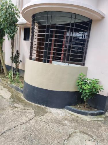 a building with a window with bars on it at A memorable place in Sylhet, Bangladesh in Sylhet