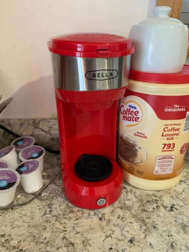 a red mixer next to a container of coffee mate at 2265 Bruckner Blvd Apartments in Bronx