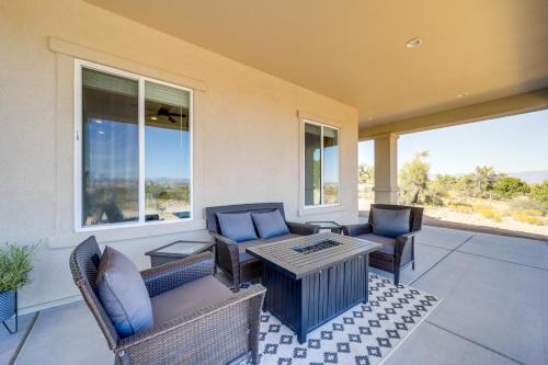 a porch with chairs and a coffee table and windows at Hikers Retreat with Furnished Patio in Rimrock! in Rimrock