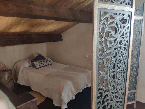 a bedroom with a bed in a room at La Chimenea Casa Rural in Granada