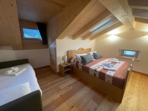 Postel nebo postele na pokoji v ubytování Chalet Le Grazie