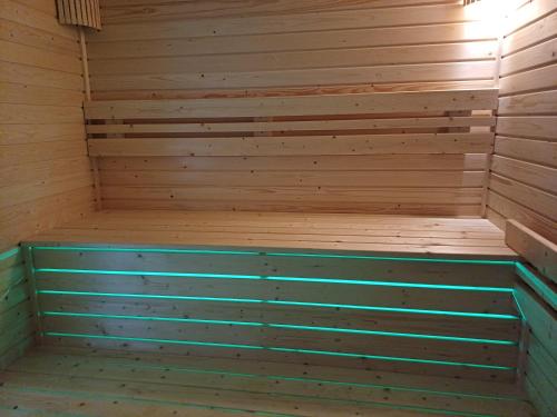 an empty sauna with wooden walls and ceilings at Benige vendégház in Demjén