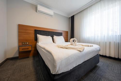 Katil atau katil-katil dalam bilik di Maltepe MANHATTAN OTEL