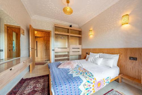 a bedroom with a large bed in a room at 22 - Grand Palace Marrakesh in Marrakech