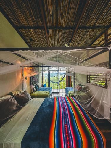 Cama o camas de una habitación en Selva Madre Eco-Sanctuary
