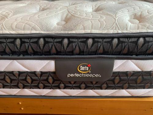a mattress sitting on top of a bed at Appartment with Hot Tub and Backyard and Free Parking in Saint-Hyacinthe