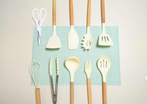 a bunch of utensils hanging on a wall at Rooftop Haven 新小岩 in Tokyo