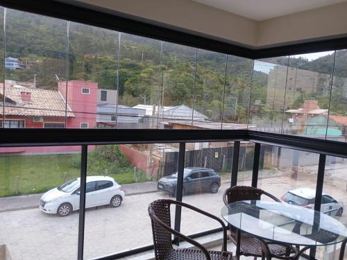 a view of a balcony with a table and chairs at Refúgio em Palmas in Governador Celso Ramos