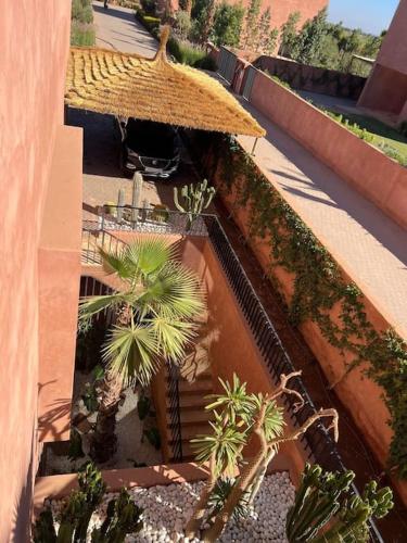 an overhead view of a building with palm trees at Dar Al Jenna - Villa de luxe avec piscine privée in Marrakech
