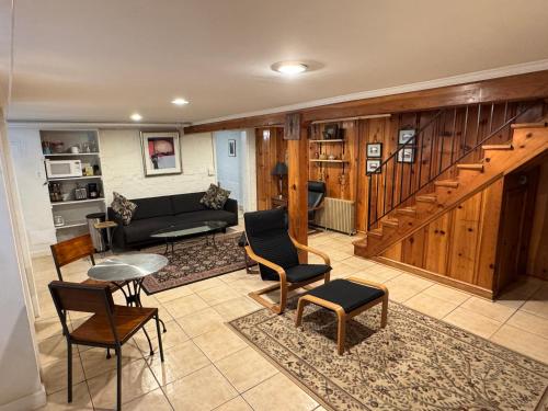 a living room with a couch and a table at First Floor One Bedroom Apartment with Full Kitchen & Bath in Washington