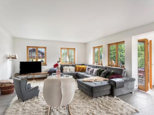 a living room with a couch and a table at Villa Kitz Kombination in Kitzbühel