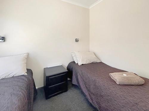 Postel nebo postele na pokoji v ubytování Outback Villas