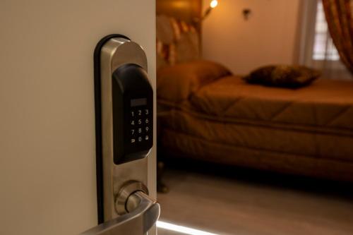 a close up of a remote control on a wall at Jacuzzi Rooms Vatican Museum in Rome