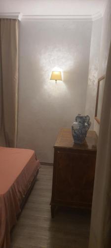 a bedroom with a bed and a table with a lamp at Sandel Giubileo Hotel in Rome