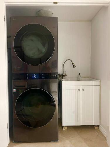 a microwave oven in a kitchen with a sink at Central Toronto in Toronto