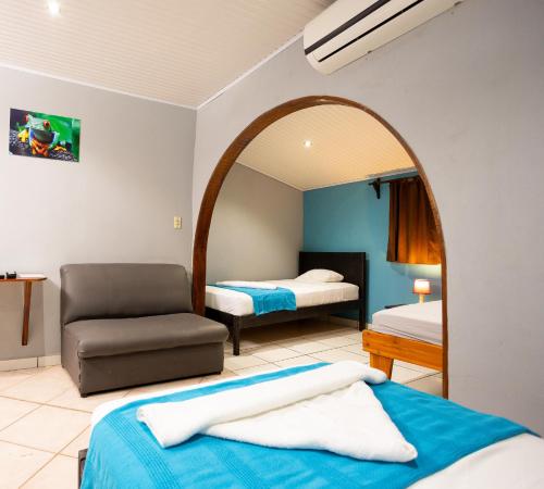 Una cama o camas en una habitación de Hospedaje Colibri
