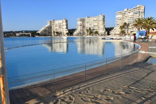 a large body of water with buildings in the background at San Alfonso del Mar Ideal in Mirasol