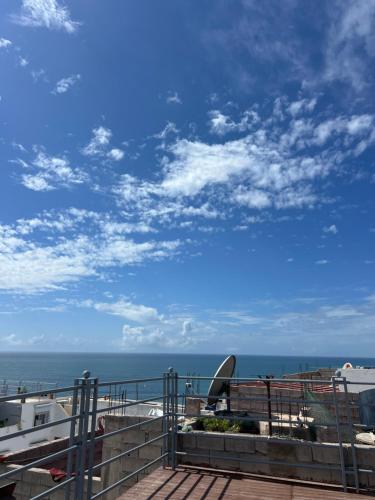 a view of the ocean from a balcony at Arinas Surf Hostel in Taghazout