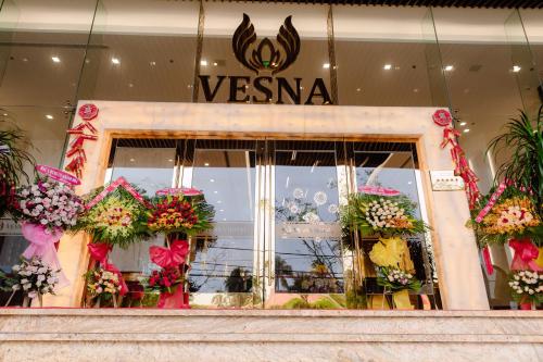 a store front with flowers in the window at Vesna Hotel Nha Trang in Nha Trang