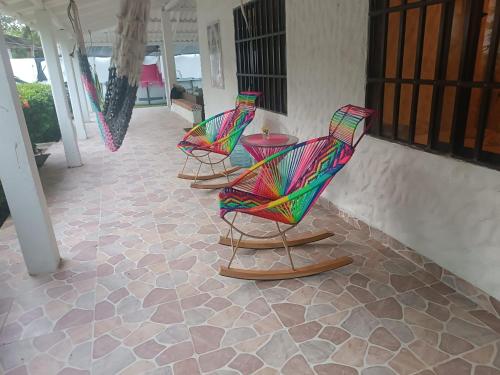 a group of chairs sitting on a patio at Casa Luna in Santa Veronica