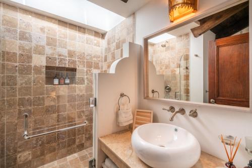 a bathroom with a sink and a mirror at Boutique Villa in Antigua in Antigua Guatemala