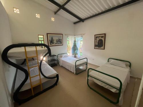 Postel nebo postele na pokoji v ubytování Hostal Macayaco