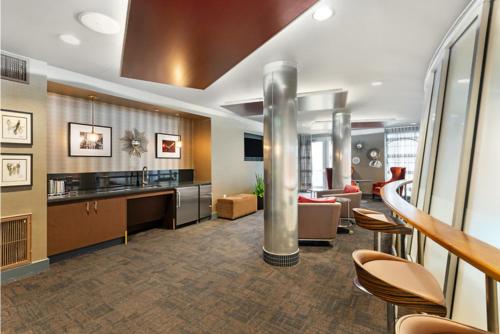a lobby with a kitchen and a living room at Modern Comfort in LA Free Parking&10 Min To Cedars in Los Angeles
