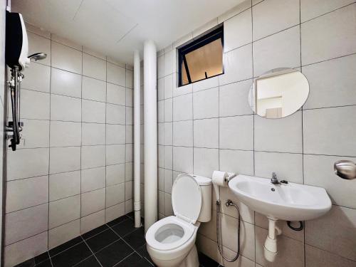 a bathroom with a toilet and a sink at New The Sun Homestay at Sg Nibong nearby Queensbay or PISA or FTZ Bayan Lepas HENG in Bayan Lepas