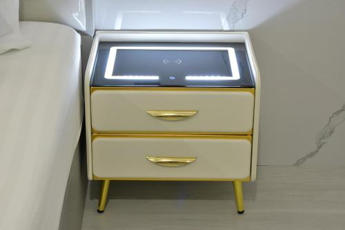 a three drawer dresser with a window on it at Berich Hotel in Tak