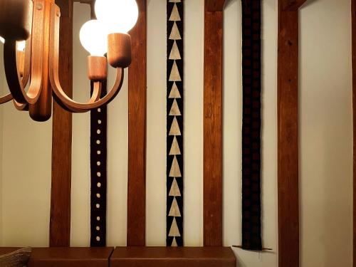a group of ties hanging on a wall at The Bath and Bed Tateyama in Toyama