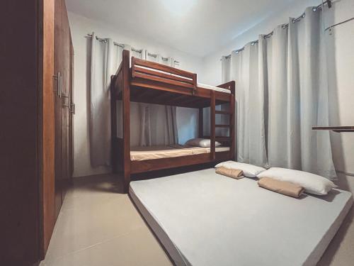 a bedroom with two bunk beds in a room at Full AC 3BR & Living Rm entire vacation home at Vigan City in Barraca