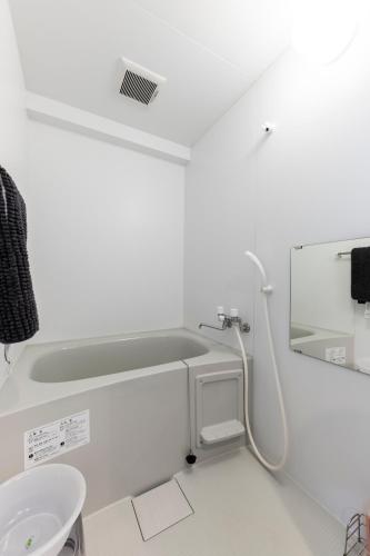a bathroom with a sink and a toilet at STARGAZE in Ōdōri