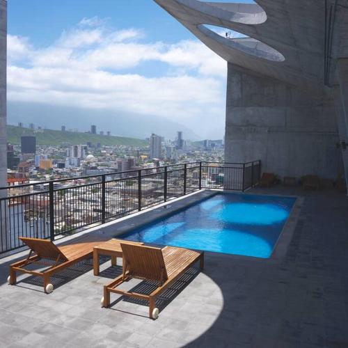 a swimming pool on top of a building at Amazing Monterrey Getaway 3 in Monterrey