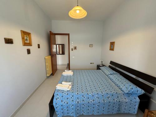 Postel nebo postele na pokoji v ubytování Residenza Tafuri